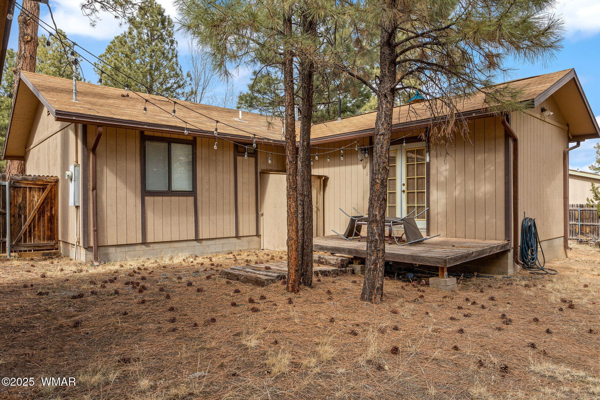 2051 Lumber Valley Road Overgaard, AZ 85933 - Photo 20 of 30 a backyard of a house with table and chairs