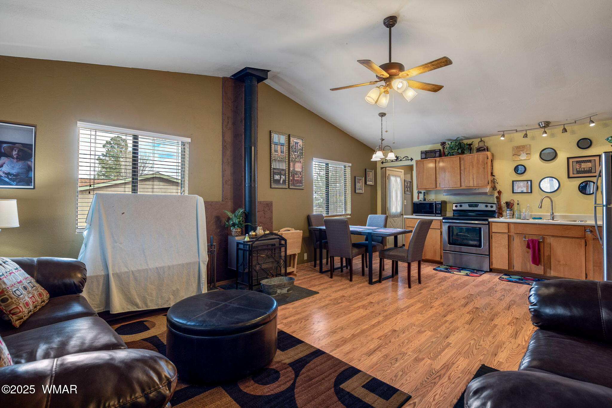 2051 Lumber Valley Road Overgaard, AZ 85933 - Photo 7 of 30 a living room with stainless steel appliances kitchen island granite countertop furniture and a dining table