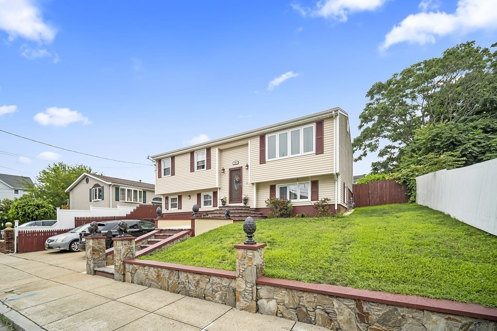 44 Judson Street Fall River, MA 02721 - Photo 1 of 31 a front view of a house with garden