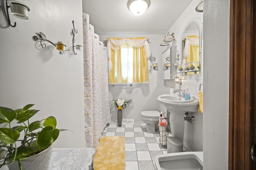 44 Judson Street Fall River, MA 02721 - Photo 11 of 31 a bathroom with a sink mirror and window