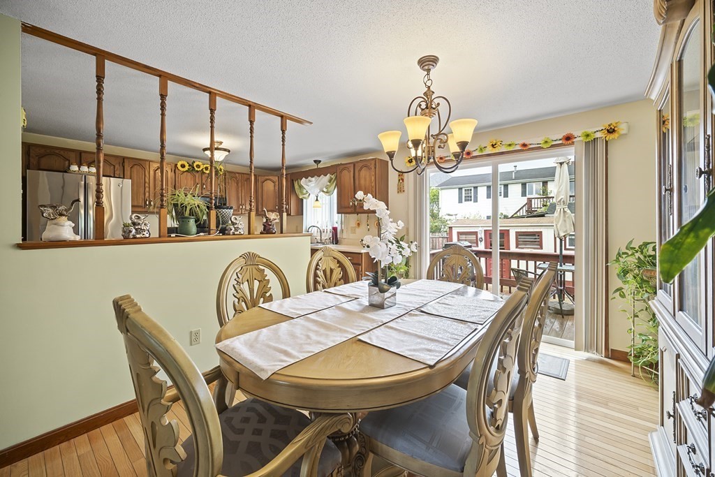 44 Judson Street Fall River, MA 02721 - Photo 15 of 31 a dining room with furniture a chandelier and wooden floor