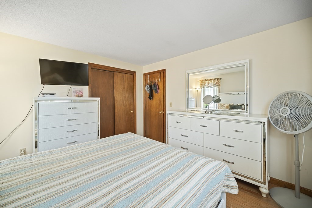 44 Judson Street Fall River, MA 02721 - Photo 17 of 31 a bedroom with a bed and a flat screen tv