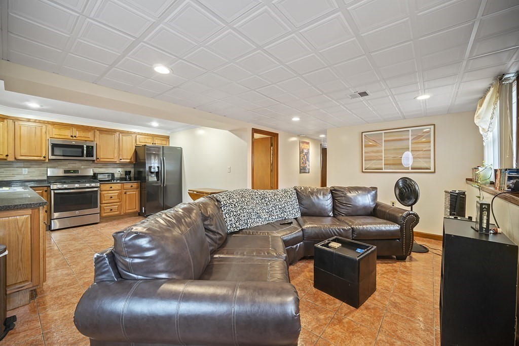 44 Judson Street Fall River, MA 02721 - Photo 24 of 31 a living room with furniture and kitchen view