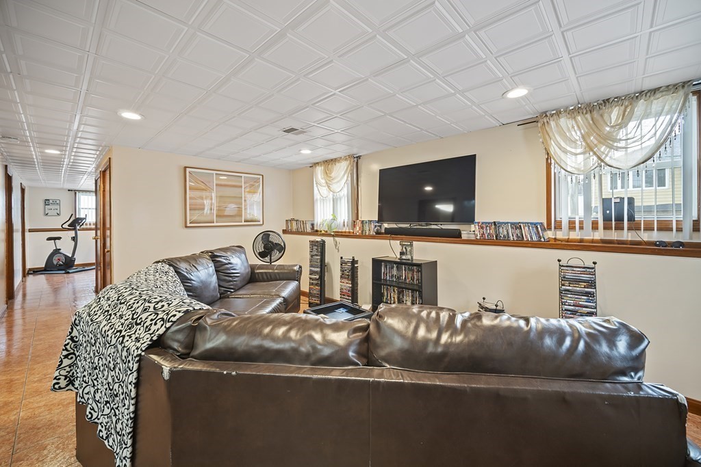 44 Judson Street Fall River, MA 02721 - Photo 25 of 31 a living room with furniture and a flat screen tv