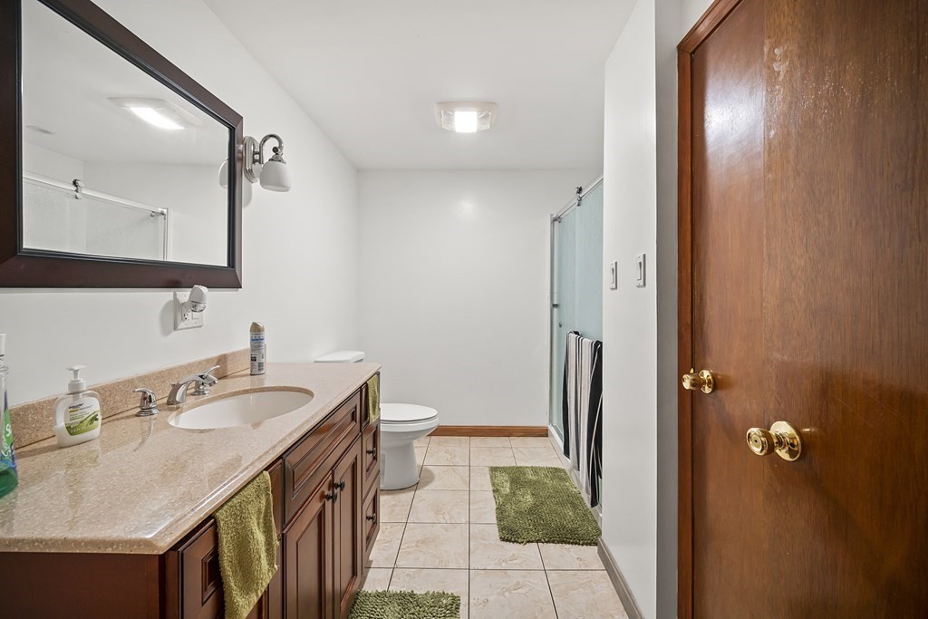 44 Judson Street Fall River, MA 02721 - Photo 27 of 31 a bathroom with a sink and a mirror