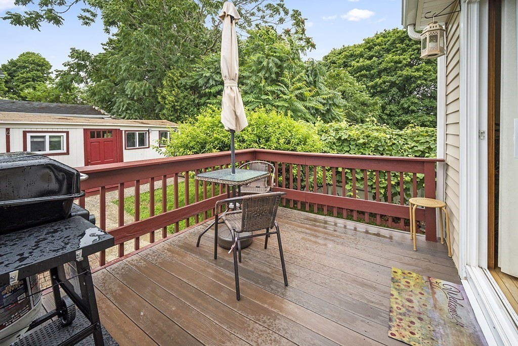 44 Judson Street Fall River, MA 02721 - Photo 7 of 31 a view of a wooden chairs and a bench in the balcony