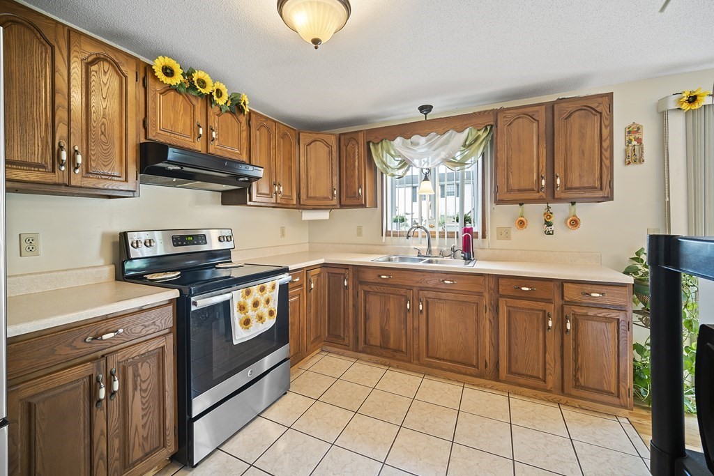 44 Judson Street Fall River, MA 02721 - Photo 8 of 31 a kitchen with stainless steel appliances granite countertop a sink stove and cabinets