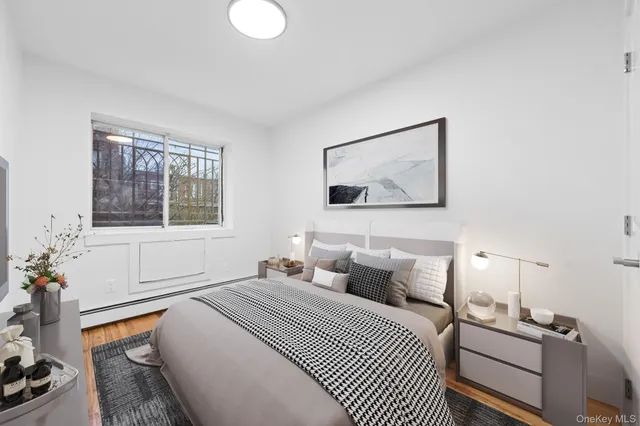 a bedroom with bed and window