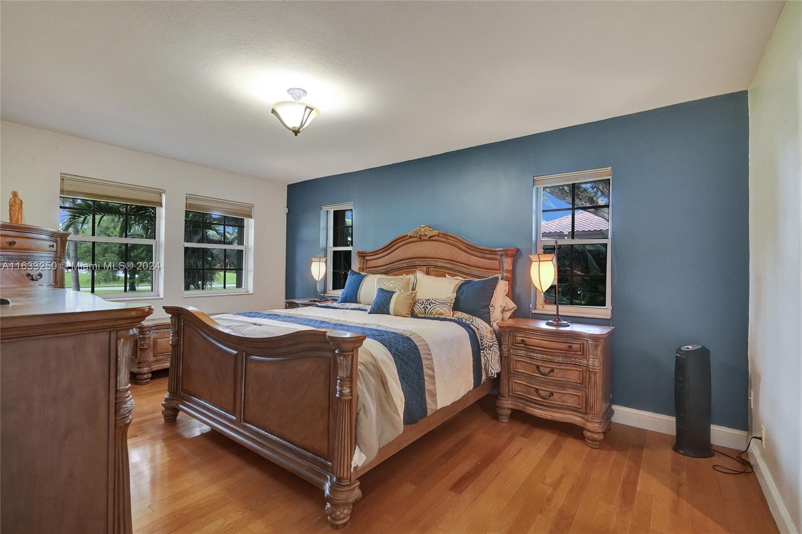 16630 Southwest 62nd Street Southwest Ranches, FL 33331 - Photo 18 of 33 a bedroom with a bed and a large window