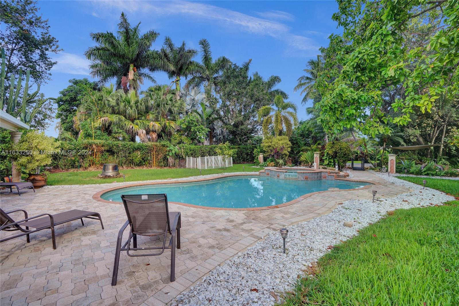 16630 Southwest 62nd Street Southwest Ranches, FL 33331 - Photo 3 of 33 a view of a swimming pool with a patio