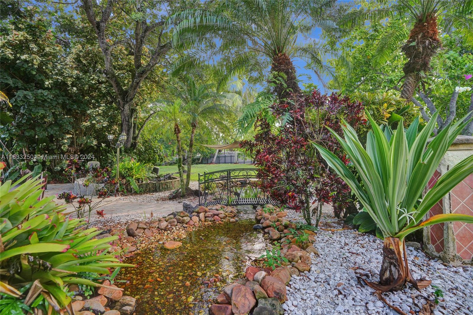 16630 Southwest 62nd Street Southwest Ranches, FL 33331 - Photo 32 of 33 a backyard of a house with lots of green space