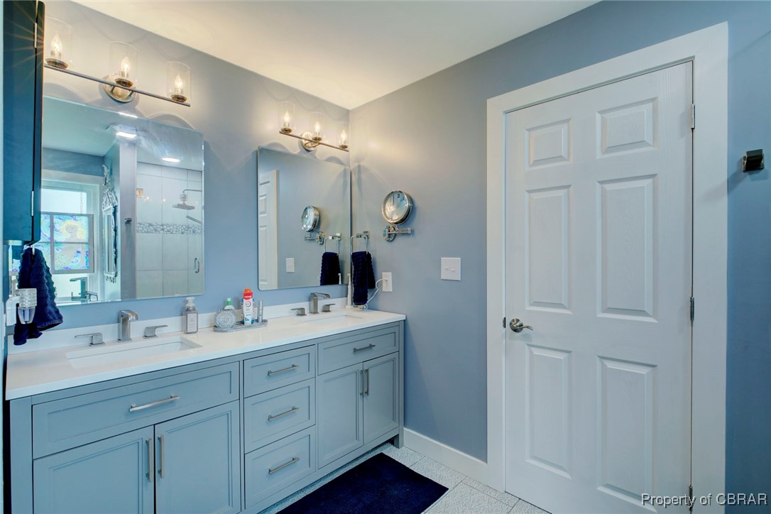 154 Twiggs Ferry Road Dutton, VA 23050 - Photo 45 of 50 Bathroom featuring vanity, tile patterned floors, and a shower with shower door