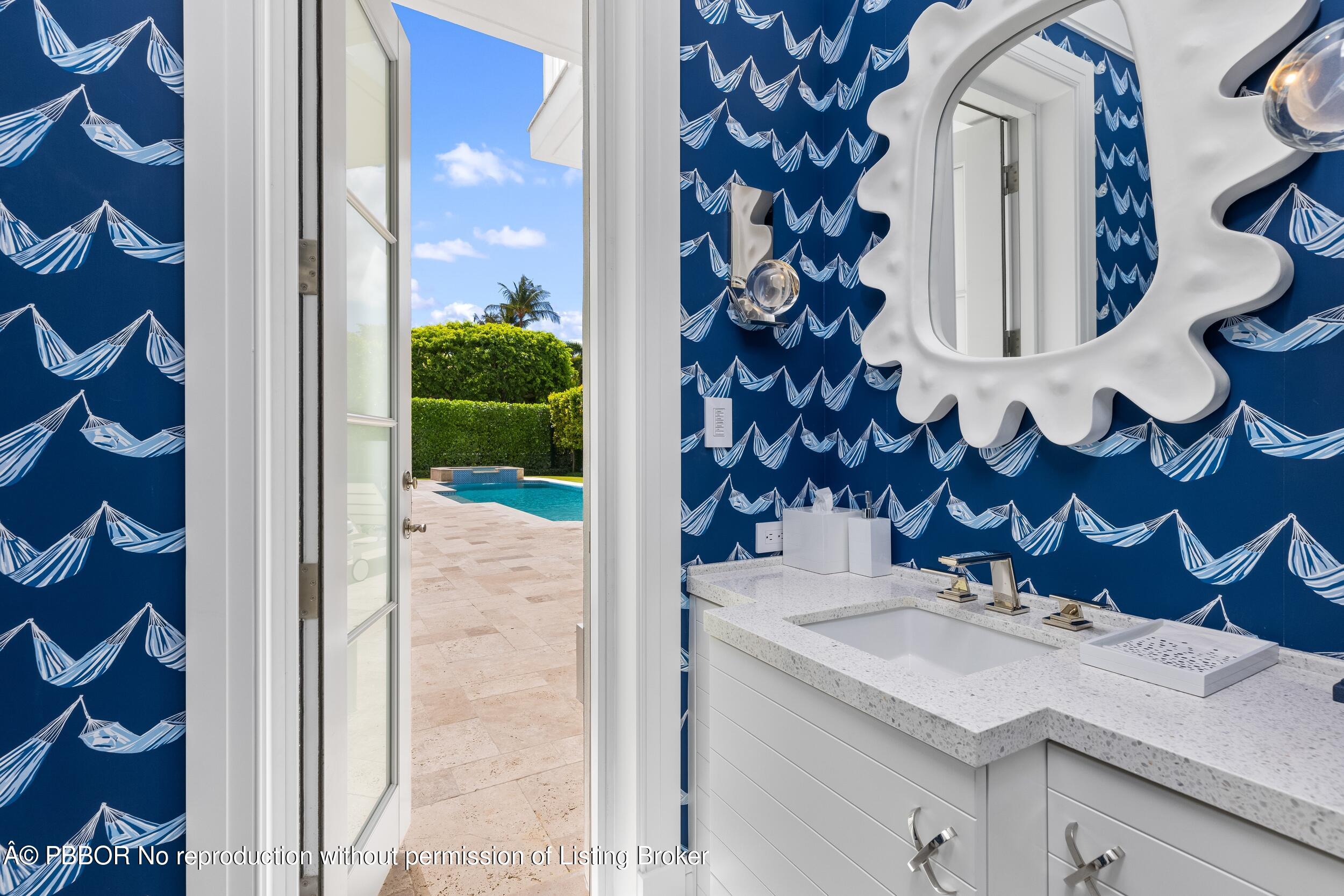 201 Banyan Road Palm Beach, FL 33480 - Photo 29 of 42 a bathroom with a sink and a mirror