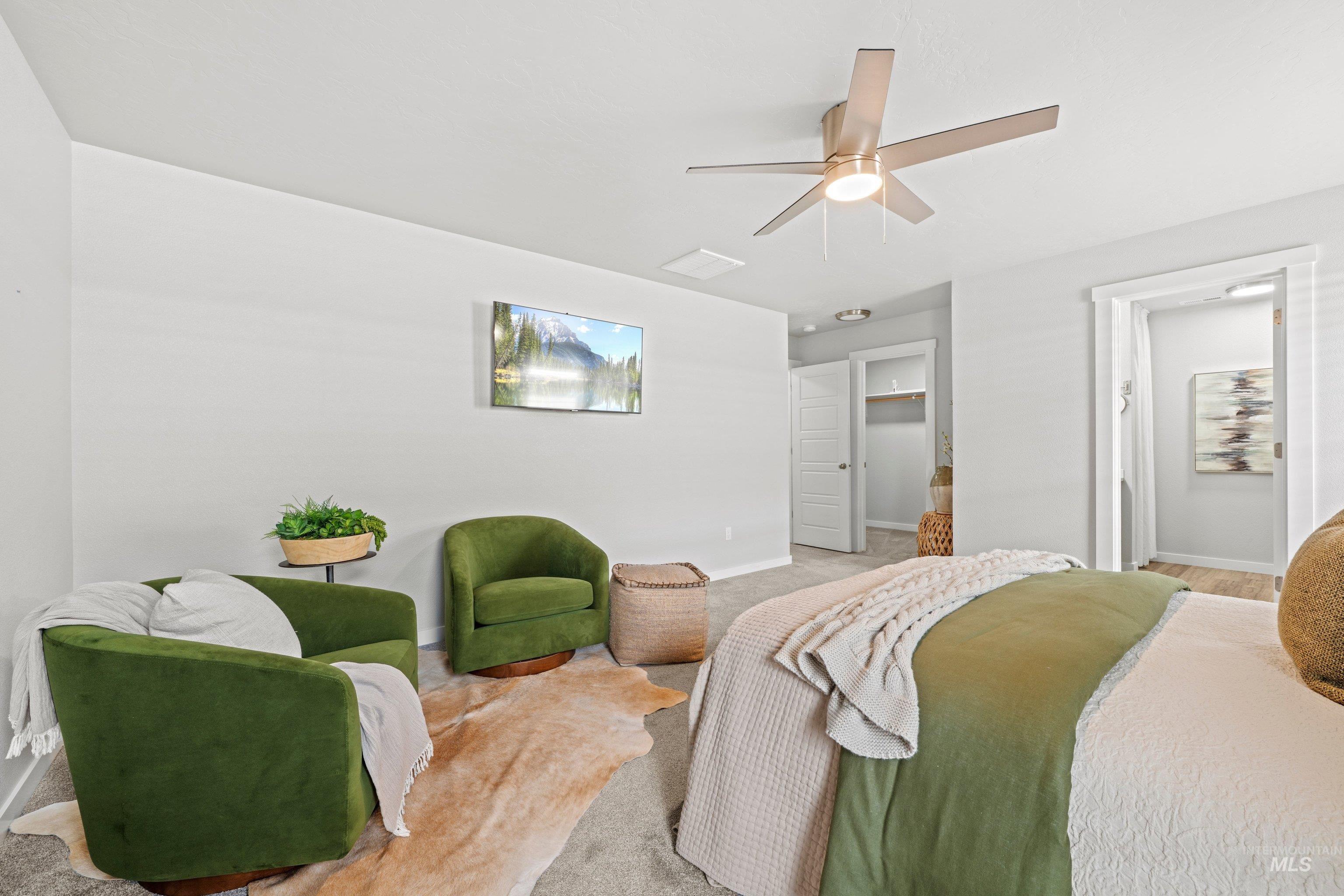 12744 West Fig Street Boise, ID 83713 - Photo 26 of 34 Spacious carpeted room featuring a contemporary ceiling fan with integrated lighting, crisp white walls, and a recessed ceiling light