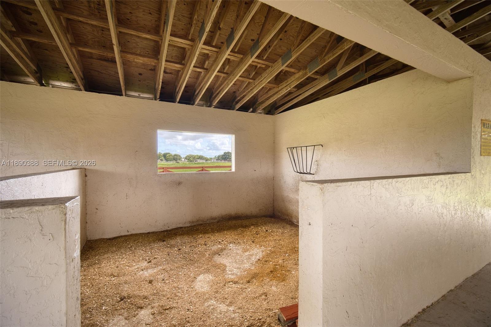 27743 Southwest 172nd Place Homestead, FL 33031 - Photo 13 of 35 a view of empty room with wooden floor