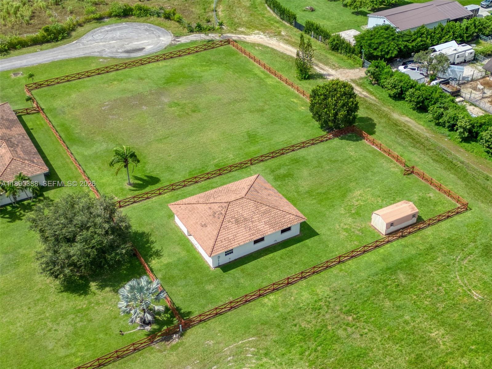 27743 Southwest 172nd Place Homestead, FL 33031 - Photo 2 of 35 an aerial view of a house