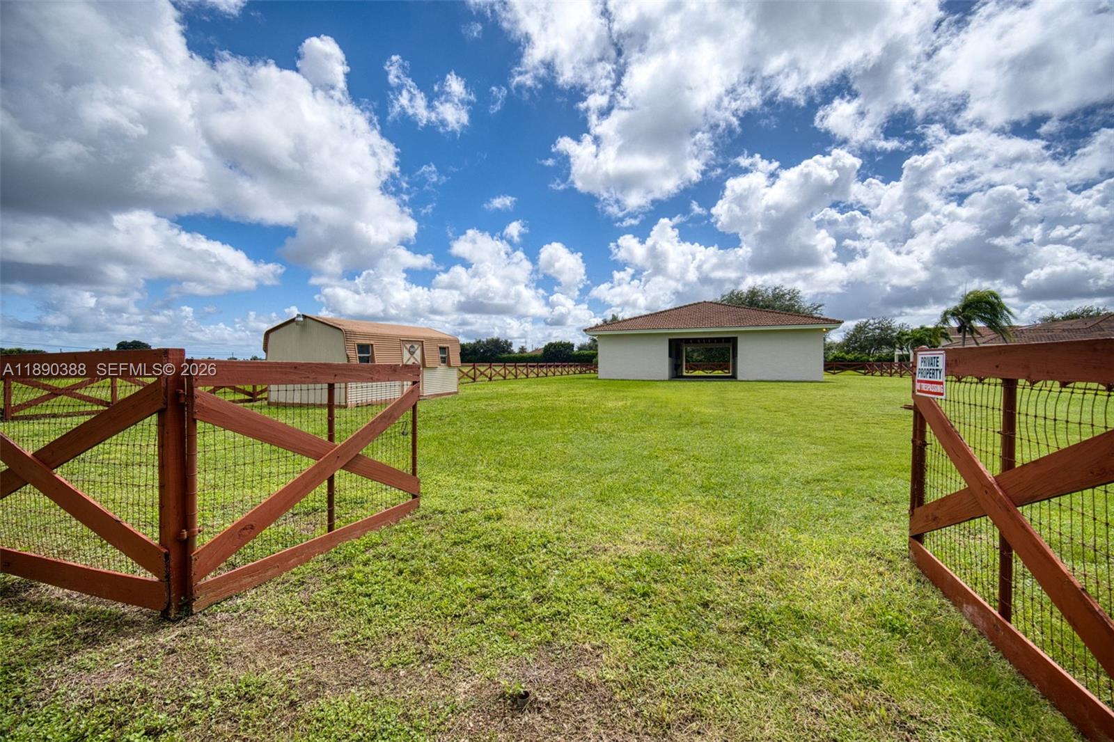 27743 Southwest 172nd Place Homestead, FL 33031 - Photo 22 of 35 a view of a house with backyard and sitting area