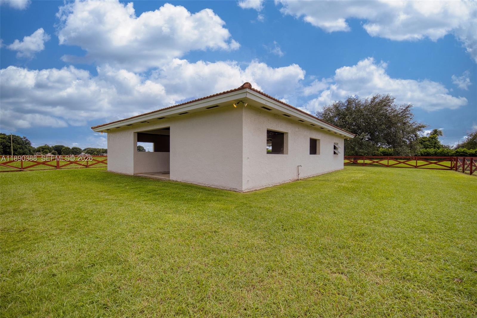 27743 Southwest 172nd Place Homestead, FL 33031 - Photo 23 of 35 a view of a house with a yard