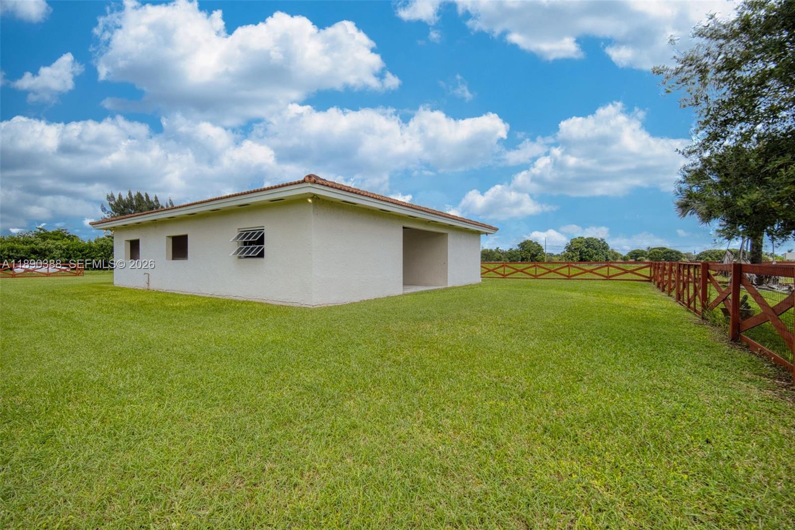 27743 Southwest 172nd Place Homestead, FL 33031 - Photo 24 of 35 a view of a house with a backyard