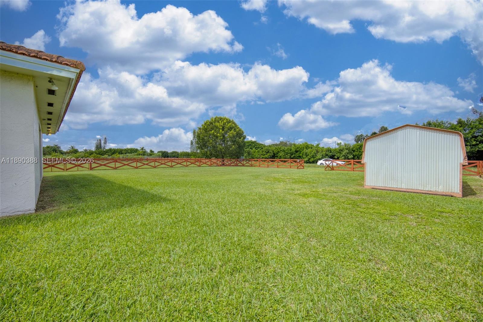 27743 Southwest 172nd Place Homestead, FL 33031 - Photo 26 of 35 a view of a big yard with a house