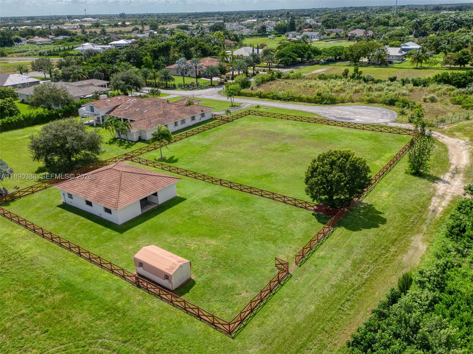 27743 Southwest 172nd Place Homestead, FL 33031 - Photo 35 of 35 an aerial view of a residential houses with outdoor space and trees all around