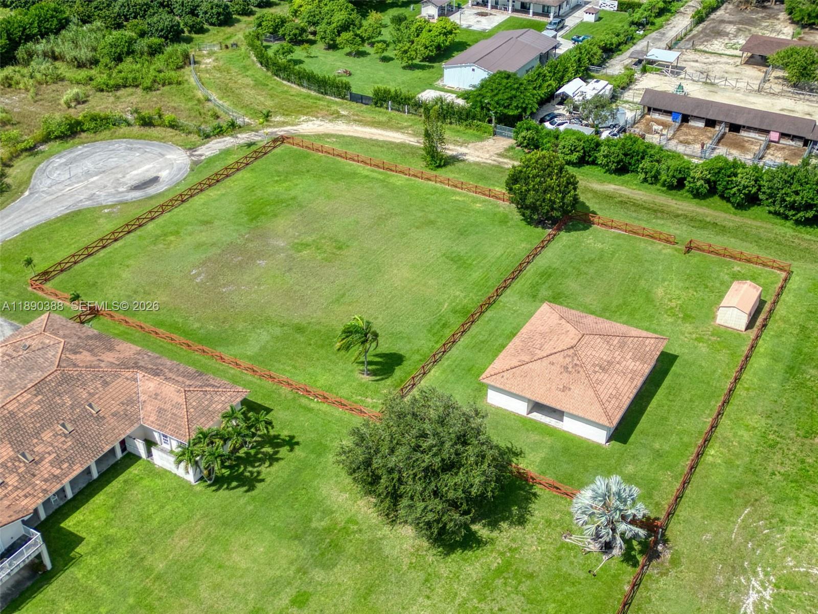 27743 Southwest 172nd Place Homestead, FL 33031 - Photo 5 of 35 an aerial view of a golf course with a garden