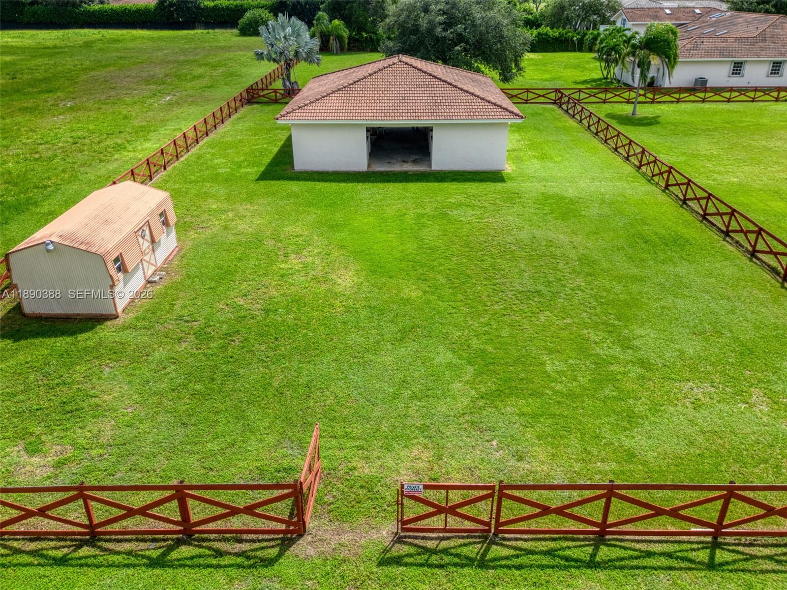 27743 Southwest 172nd Place Homestead, FL 33031 - Photo 6 of 35 a view of a table and chairs with the view of big yard