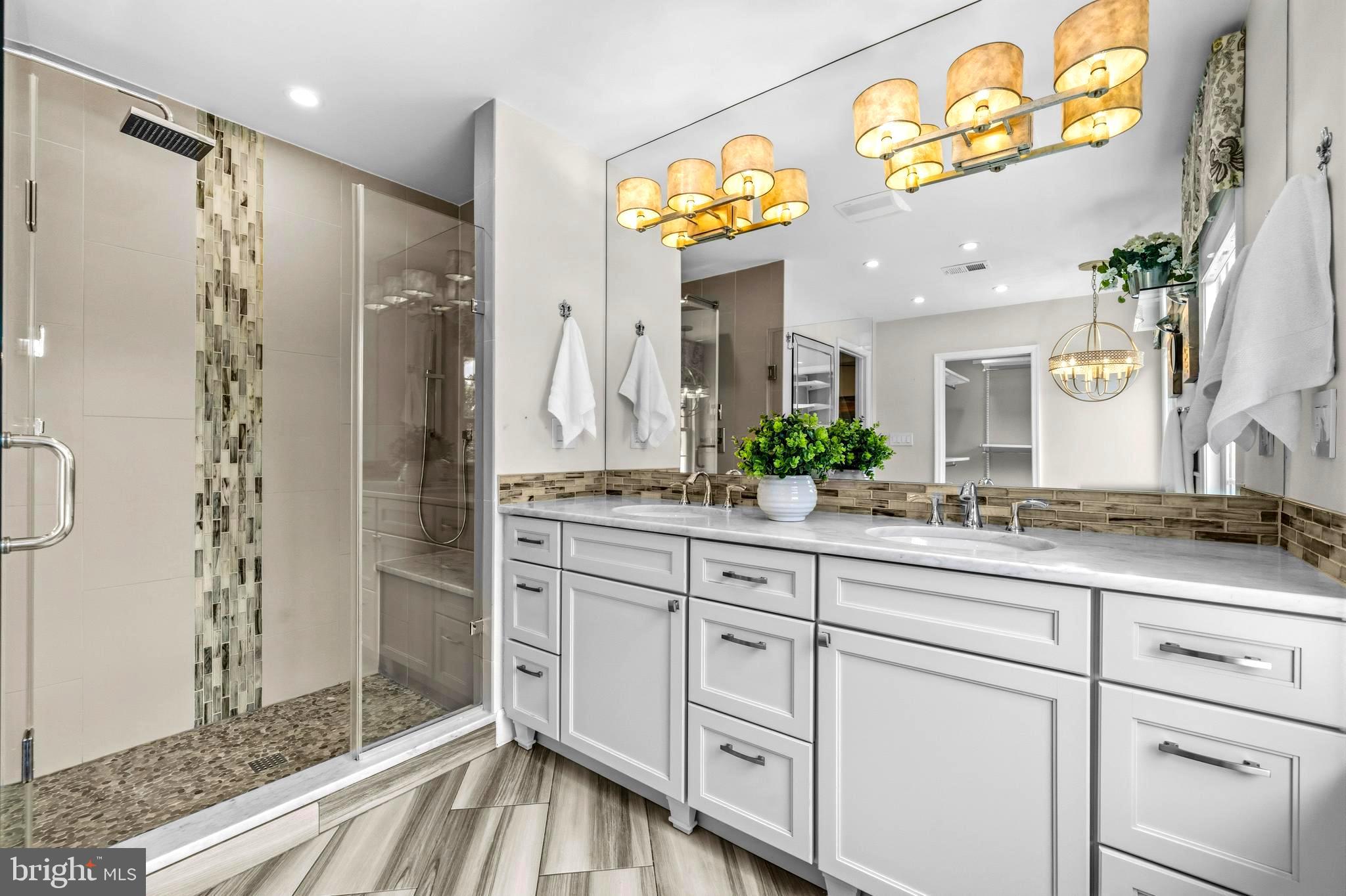 4007 West Braddock Road Alexandria, VA 22304 - Photo 25 of 52 a spacious bathroom with a granite countertop sink mirror and shower