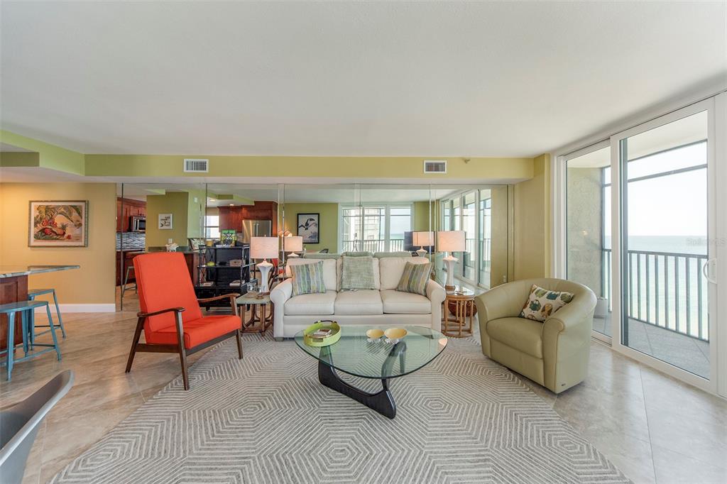 15400 Gulf Boulevard, Unit 505 Madeira Beach, FL 33708 - Photo 11 of 27 a living room with furniture and a window