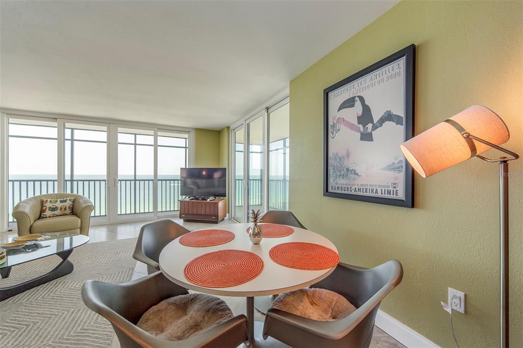15400 Gulf Boulevard, Unit 505 Madeira Beach, FL 33708 - Photo 10 of 27 a living room with furniture and a floor to ceiling window