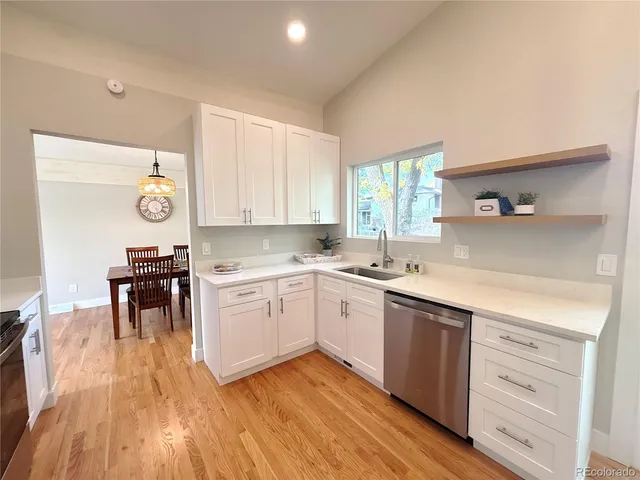 a kitchen with a sink and cabinets