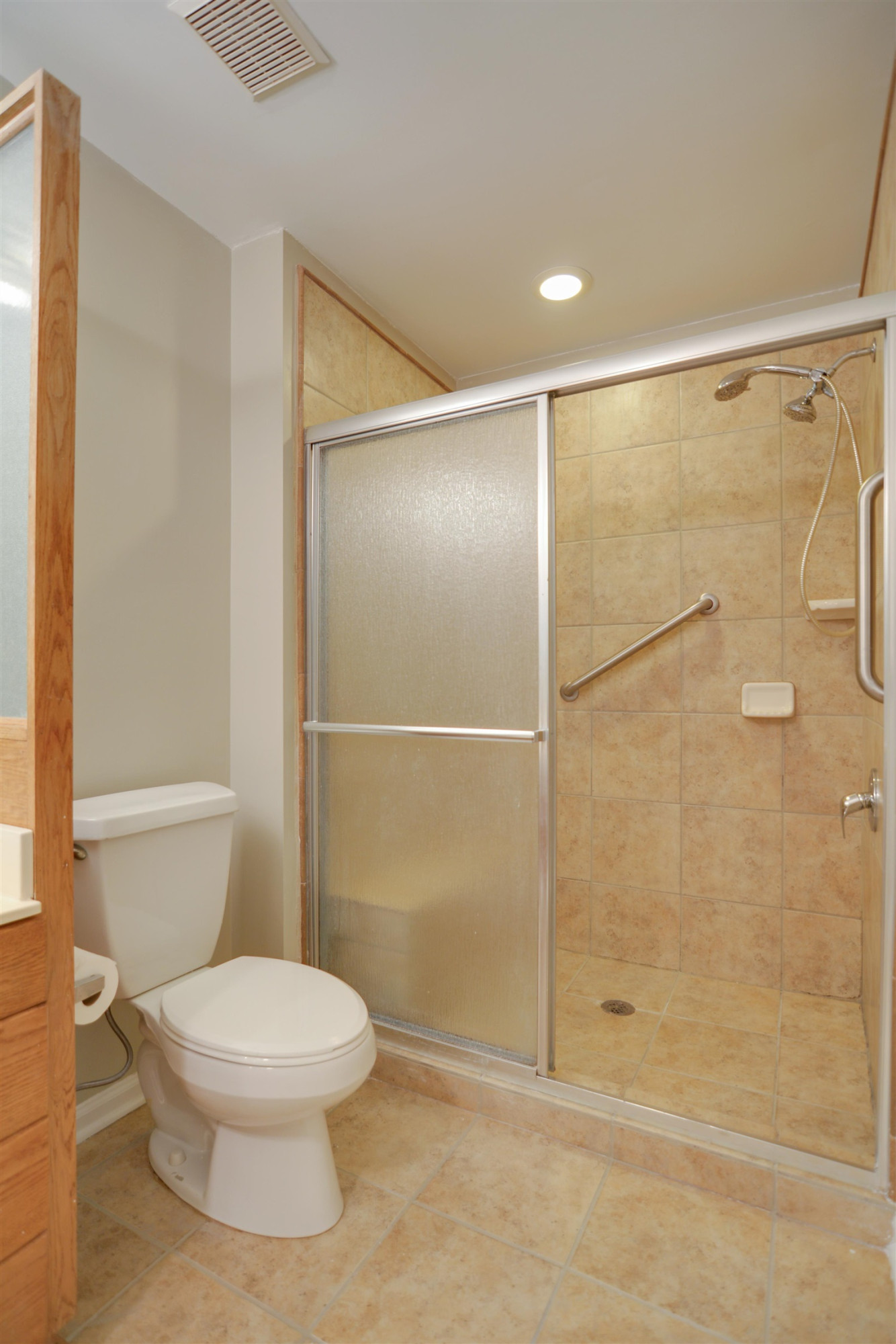 114 Breakers Place Cary, NC 27511 - Photo 14 of 19 a bathroom with a toilet and a shower