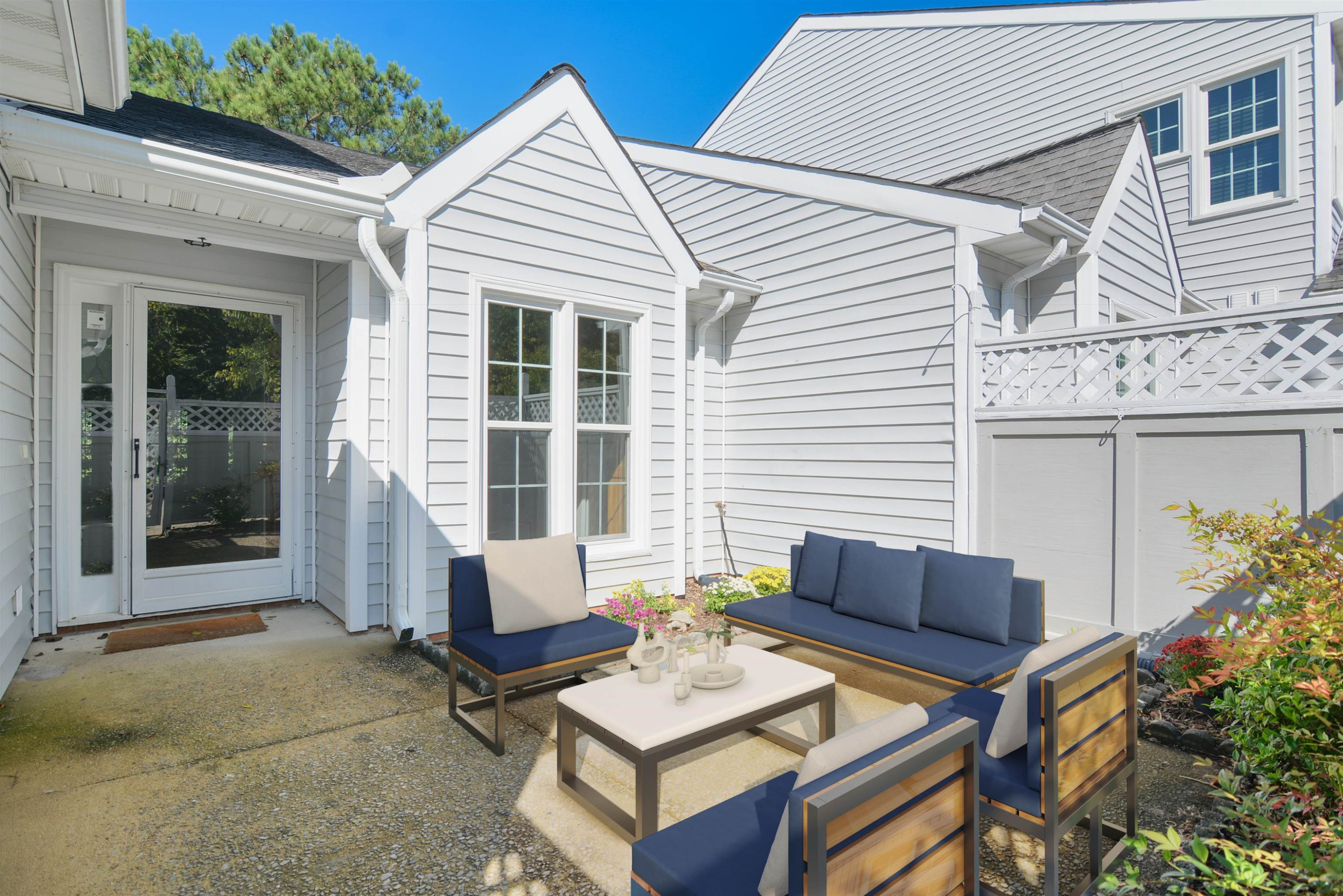 114 Breakers Place Cary, NC 27511 - Photo 4 of 19 a view of a patio with couches table and chairs and potted plants