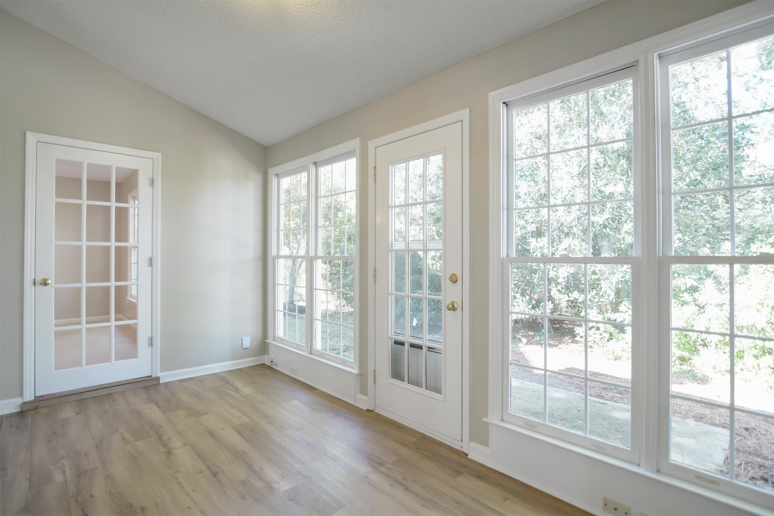 114 Breakers Place Cary, NC 27511 - Photo 8 of 19 a view of an empty room with wooden floor and windows