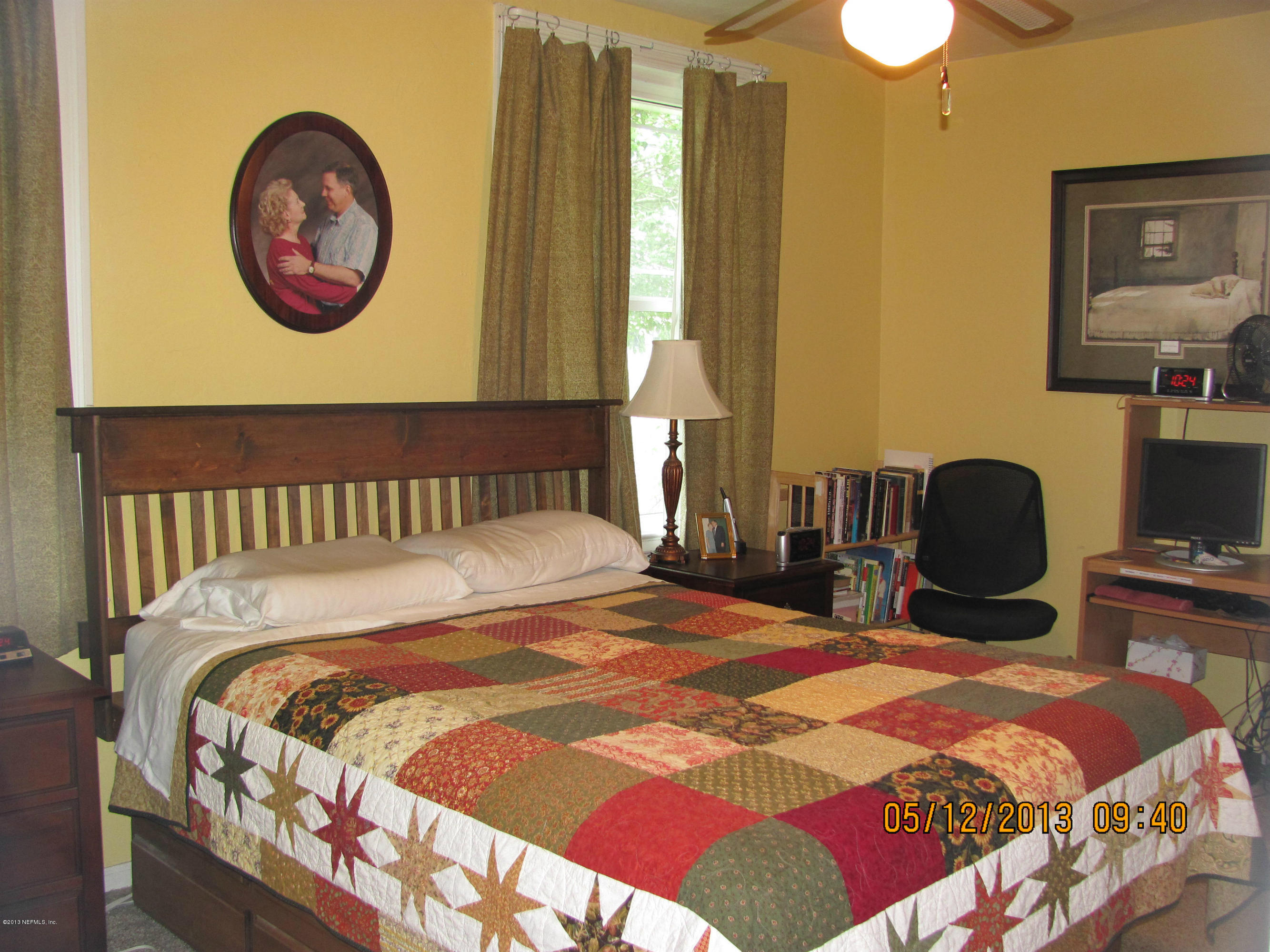 2121 Southampton Road Jacksonville, FL 32207 - Photo 11 of 21 a bedroom with a bed a mirror on dresser and a large mirror