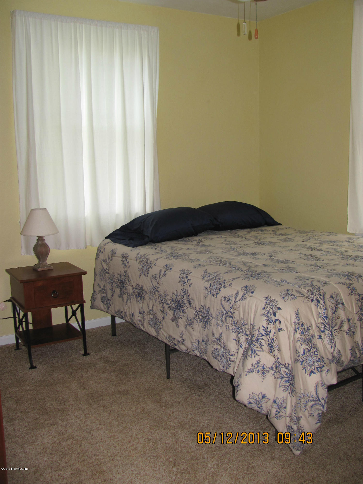 2121 Southampton Road Jacksonville, FL 32207 - Photo 14 of 21 a bedroom with a bed and a window