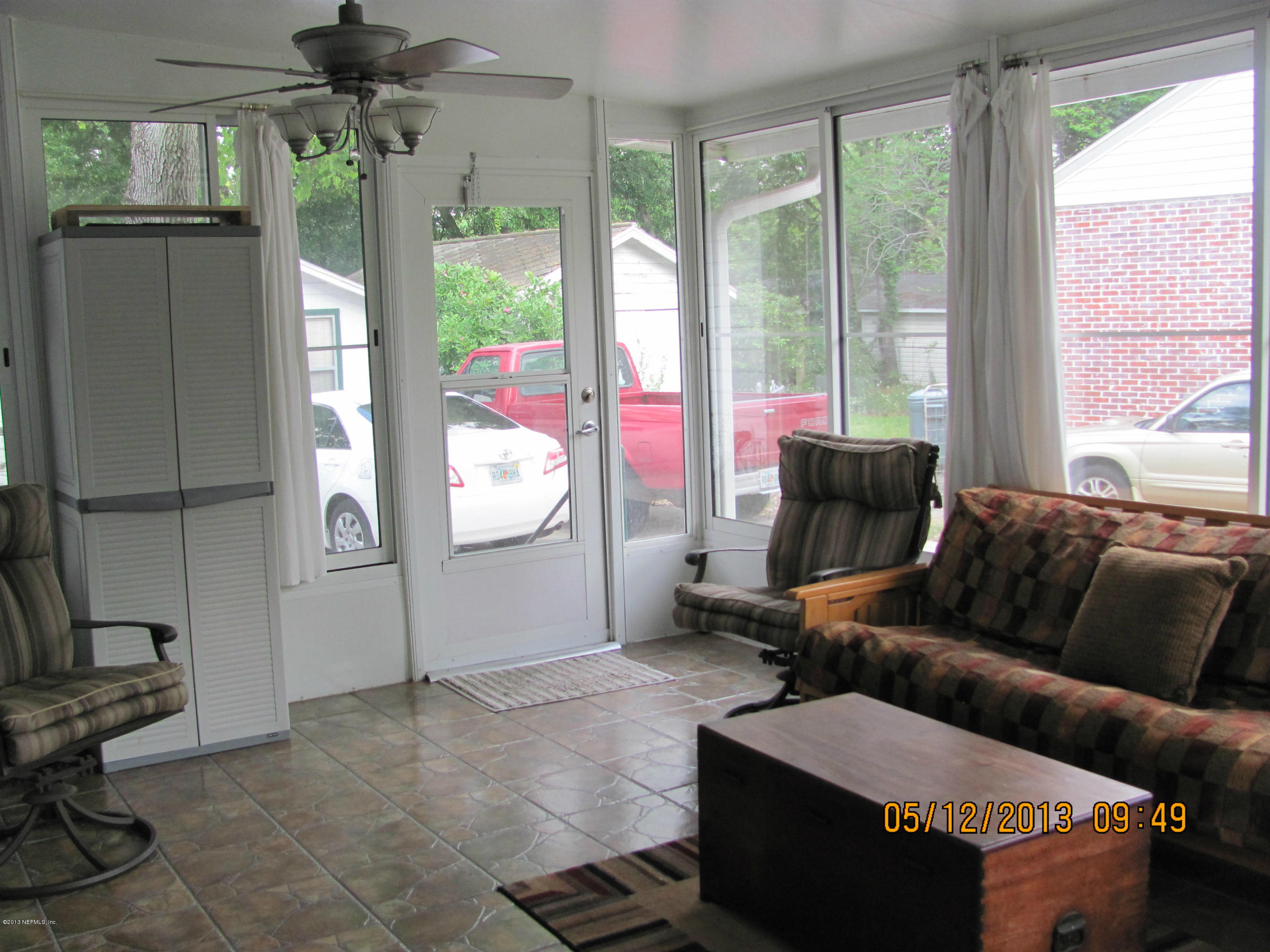 2121 Southampton Road Jacksonville, FL 32207 - Photo 21 of 21 a living room with furniture and a floor to ceiling window