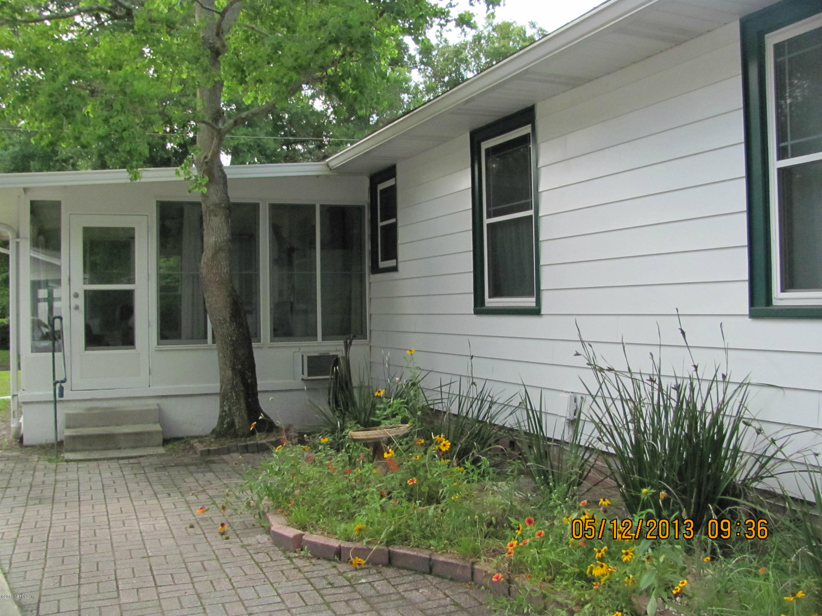 2121 Southampton Road Jacksonville, FL 32207 - Photo 5 of 21 a front view of a house with a yard