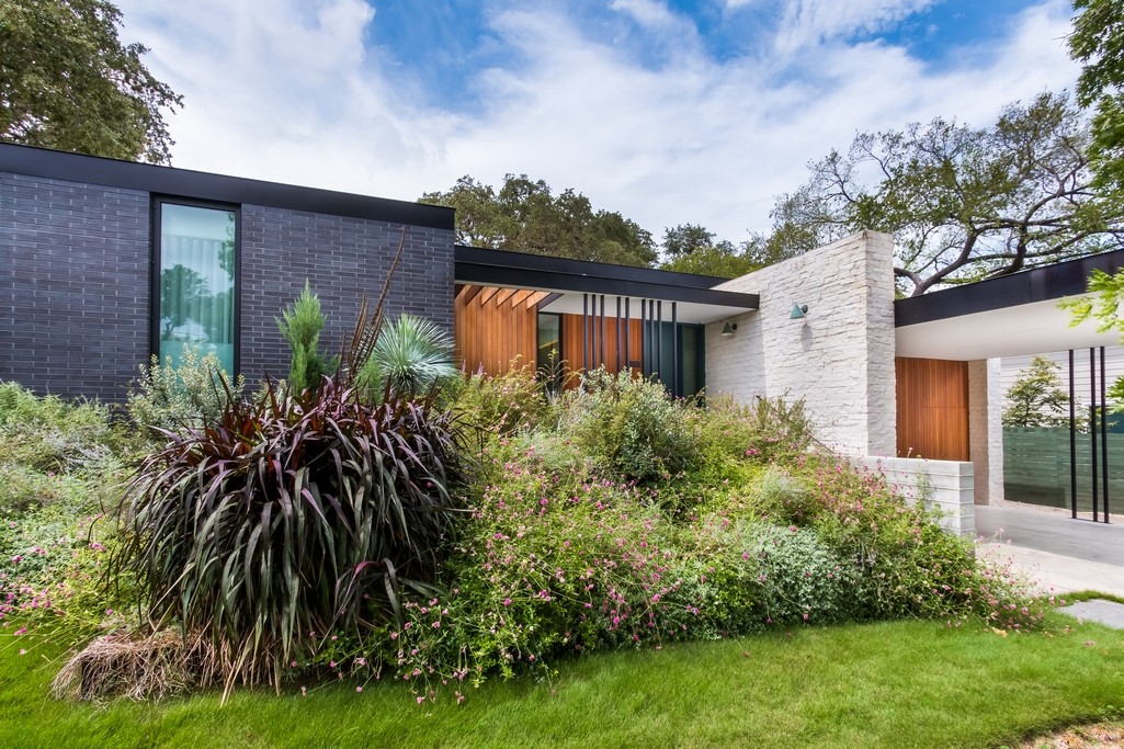 1904 Paramount Avenue Austin, TX 78704 - Photo 1 of 1 a front view of a house with a garden