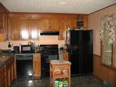 2405 Old Ferrum Road Ferrum, VA 24088 - Photo 4 of 9 a kitchen with stainless steel appliances granite countertop a refrigerator and a stove