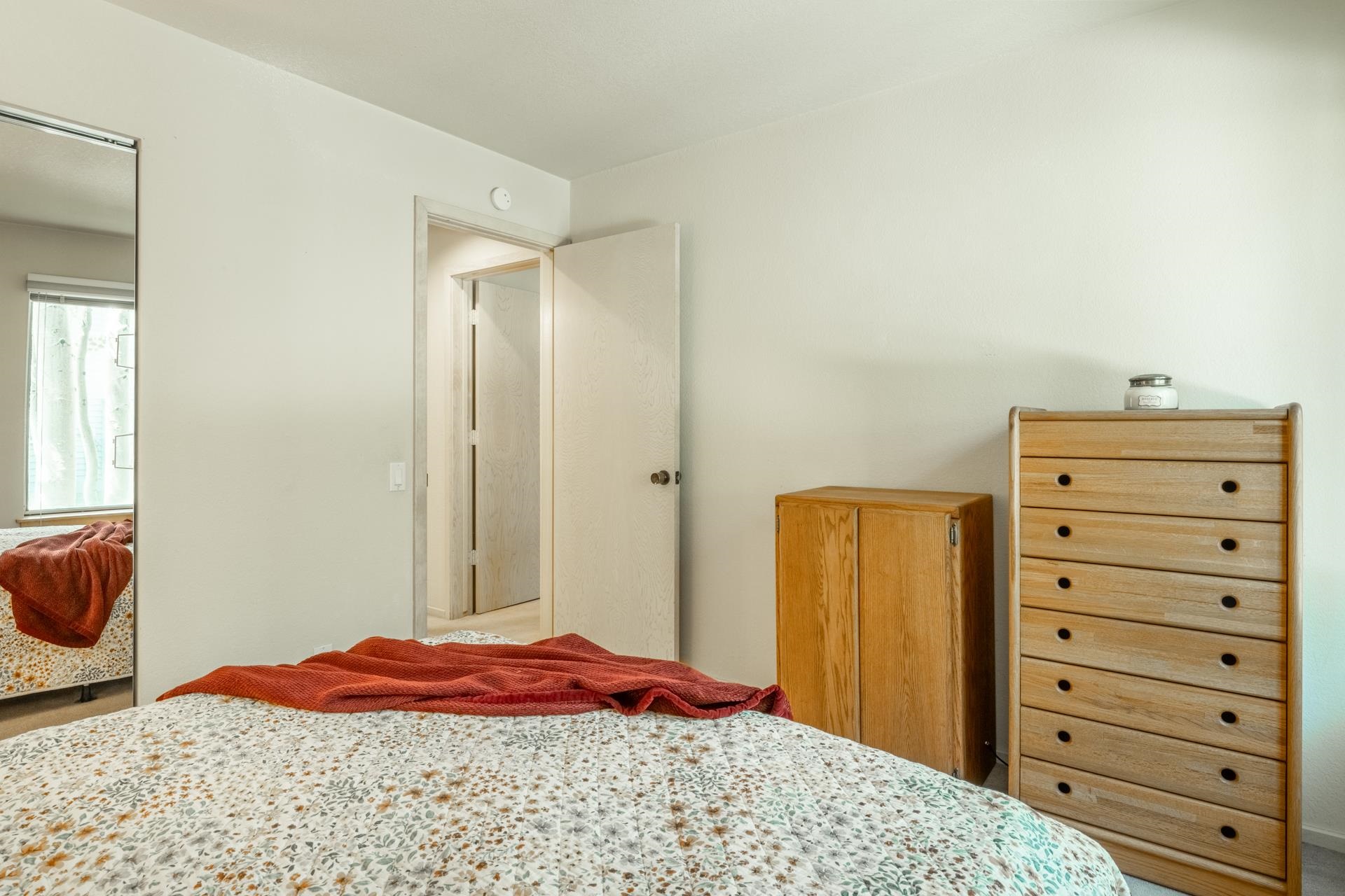 609 Golden Creek Road, Unit 609 Mammoth Lakes, CA 93546 - Photo 15 of 42 Bedroom featuring light-colored walls and a mirrored closet door