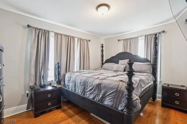 a bedroom with a bed and a tv