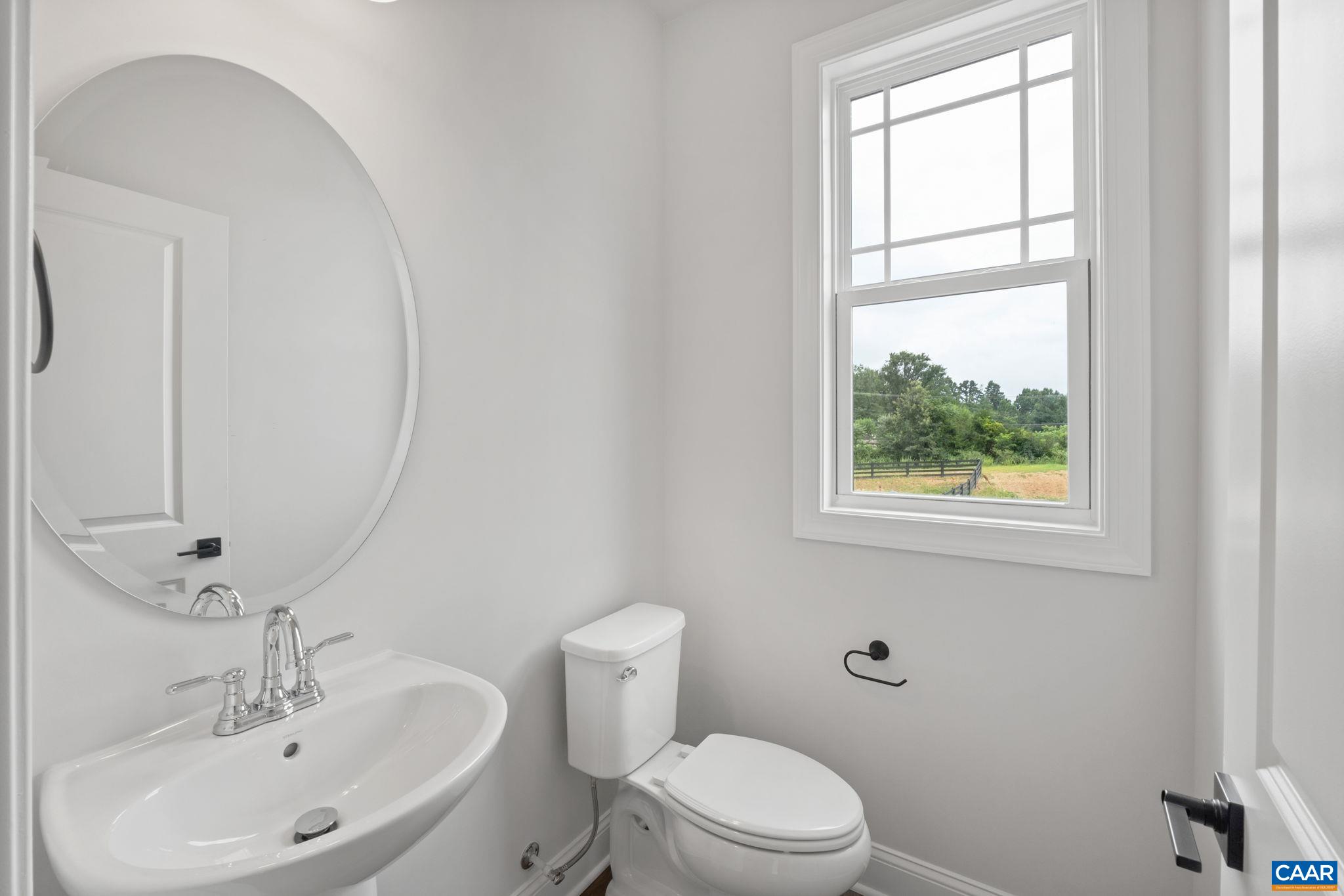 135 Park Ridge Drive Crozet, VA 22932 - Photo 21 of 46 a bathroom with a sink a toilet and a mirror