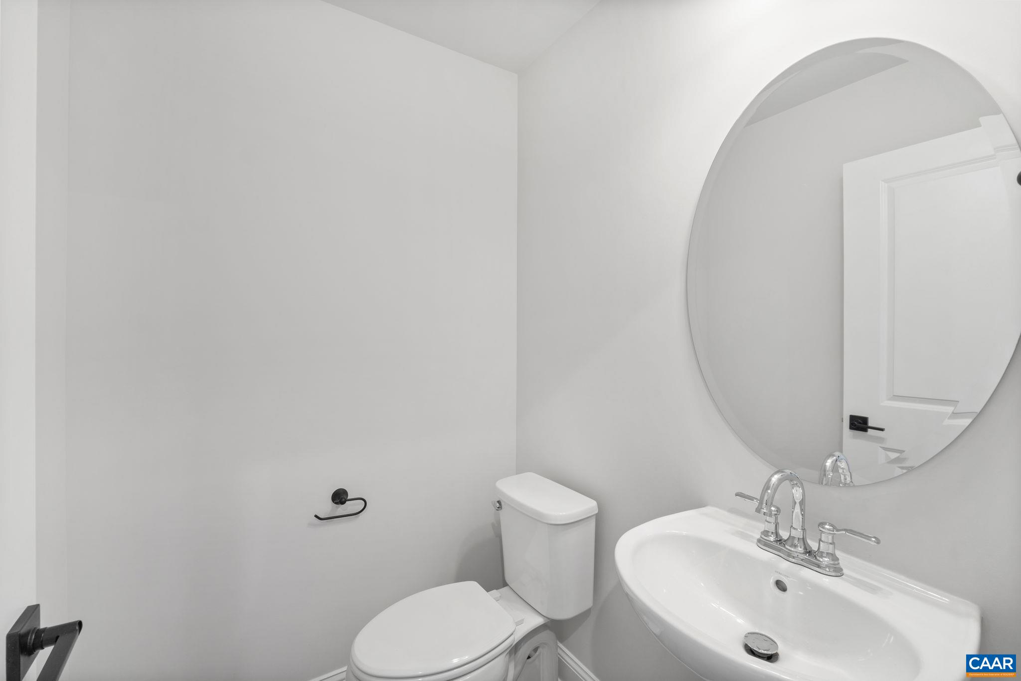 135 Park Ridge Drive Crozet, VA 22932 - Photo 9 of 46 a bathroom with a toilet a sink and mirror