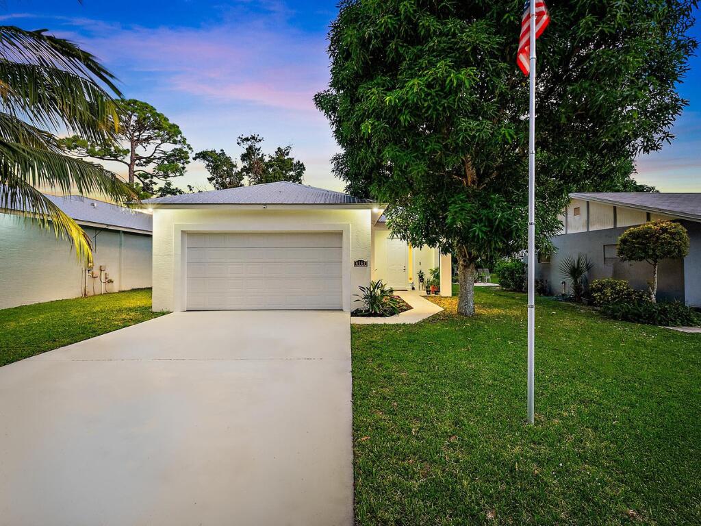 6762 2nd Street Jupiter, FL 33458 - Photo 1 of 27 a view of a back yard of the house