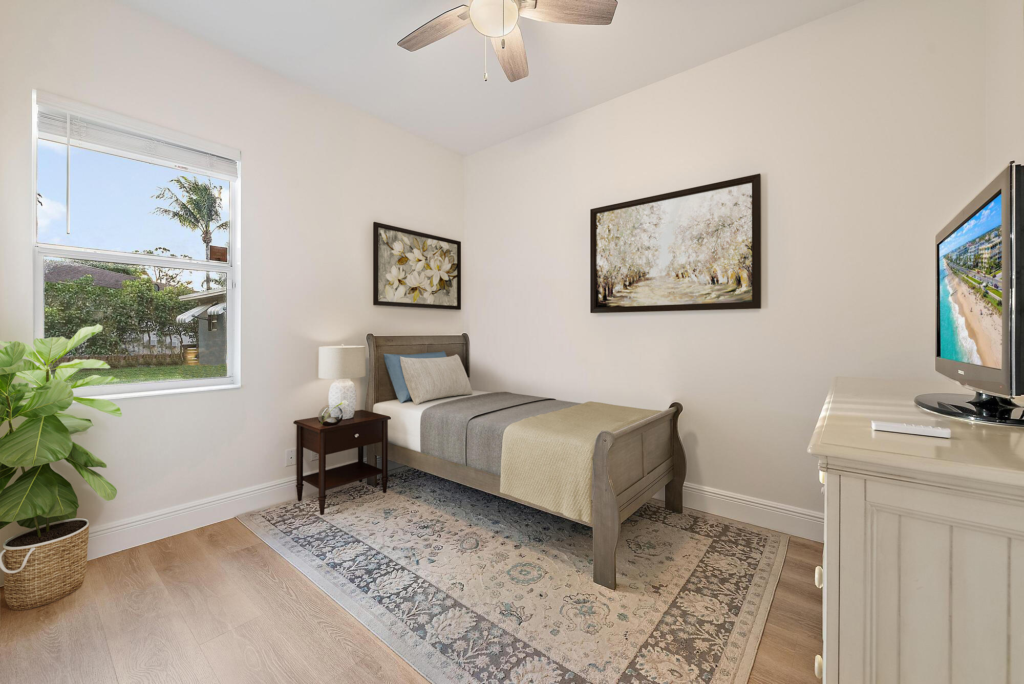 6762 2nd Street Jupiter, FL 33458 - Photo 20 of 27 a bedroom with a bed and a flat screen tv