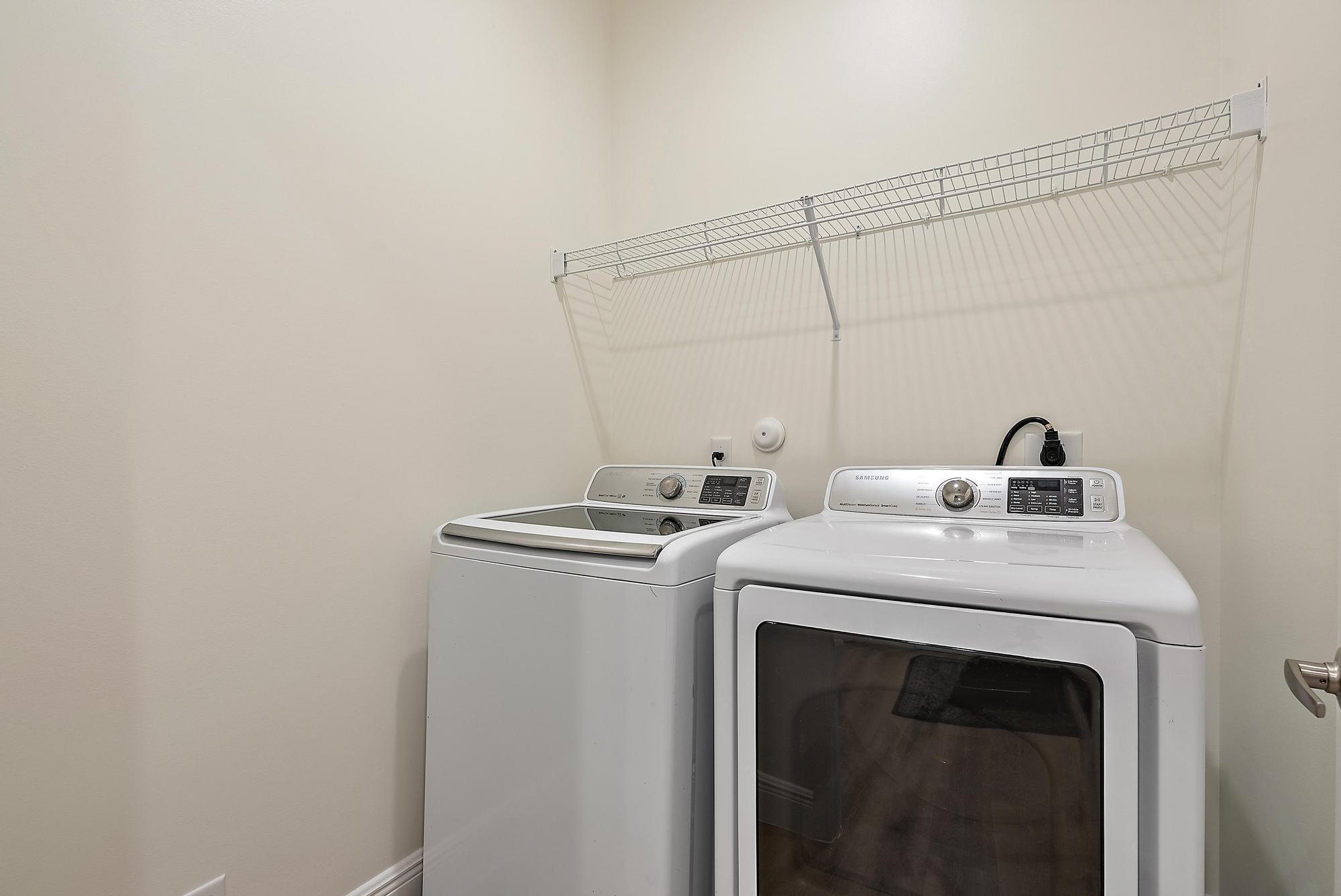 6762 2nd Street Jupiter, FL 33458 - Photo 21 of 27 a utility room with dryer and washer