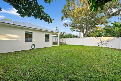 a backyard of a house with lots of green space