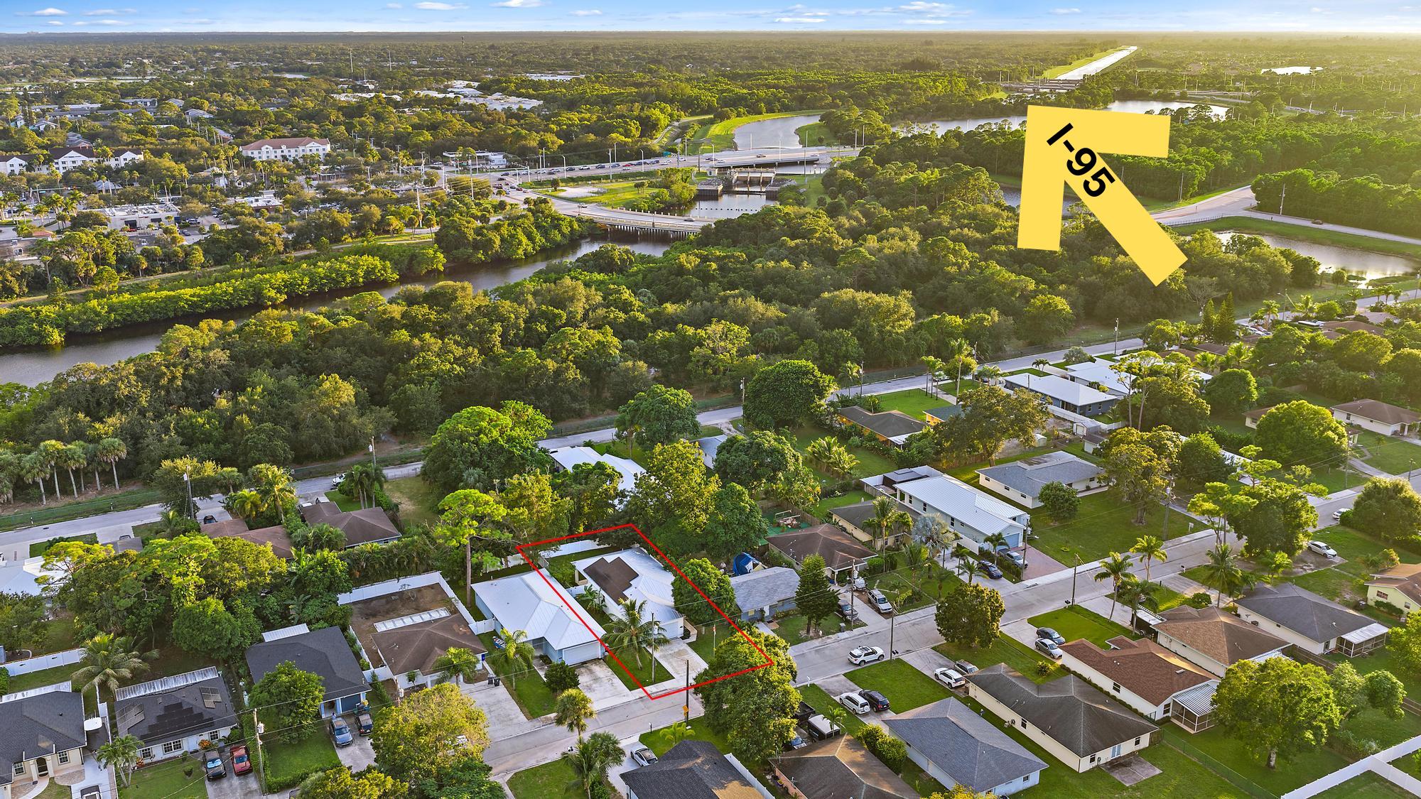6762 2nd Street Jupiter, FL 33458 - Photo 25 of 27 an aerial view of residential building with parking space