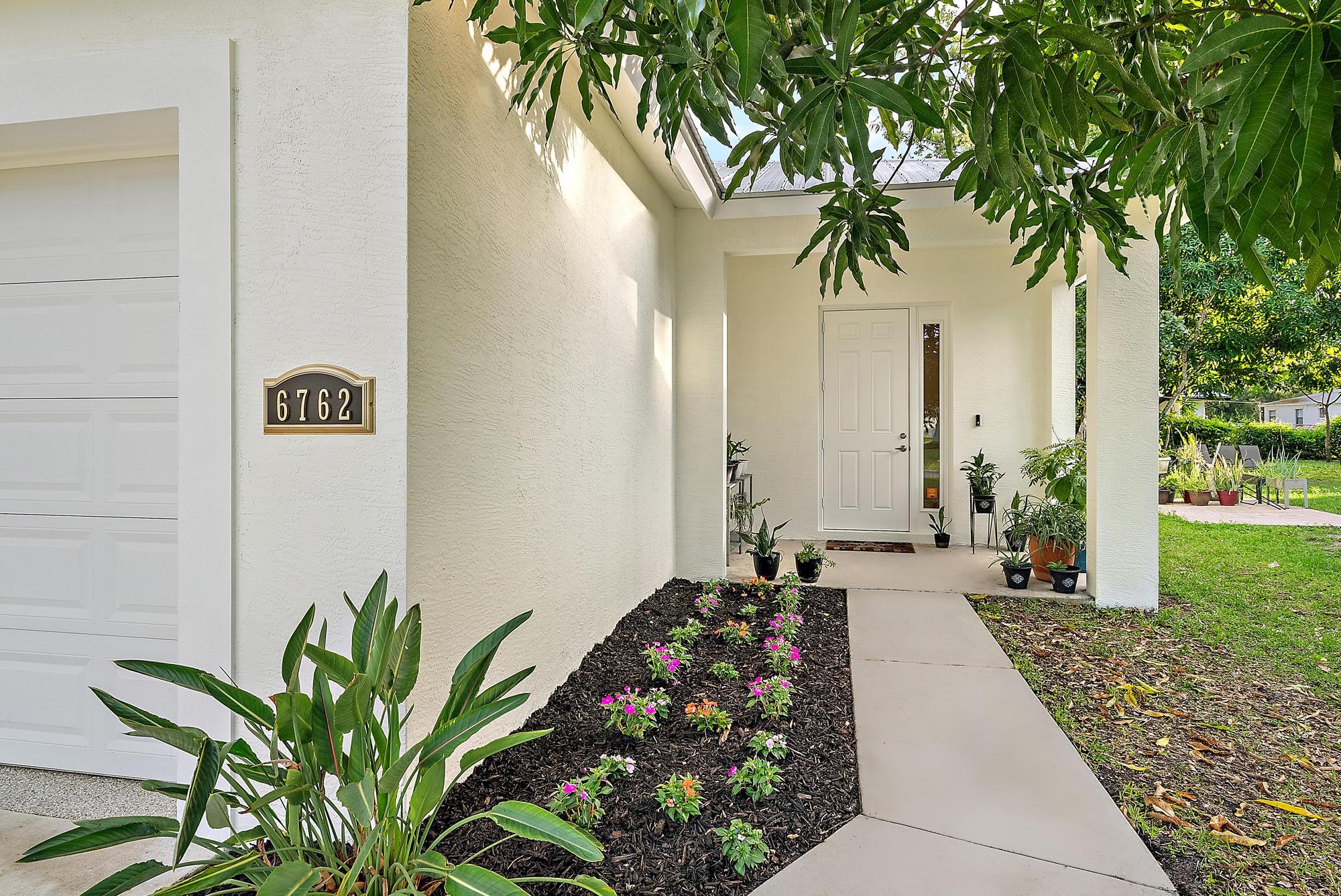 6762 2nd Street Jupiter, FL 33458 - Photo 6 of 27 a front view of a house